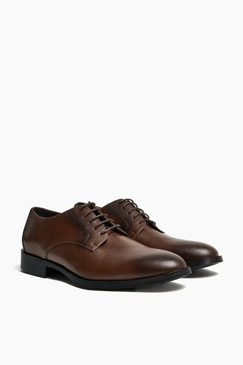 Sapatos com atacadores · Homem