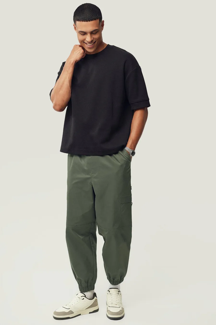 Calças jogger em poliéster · Homem · Verde Oliveira