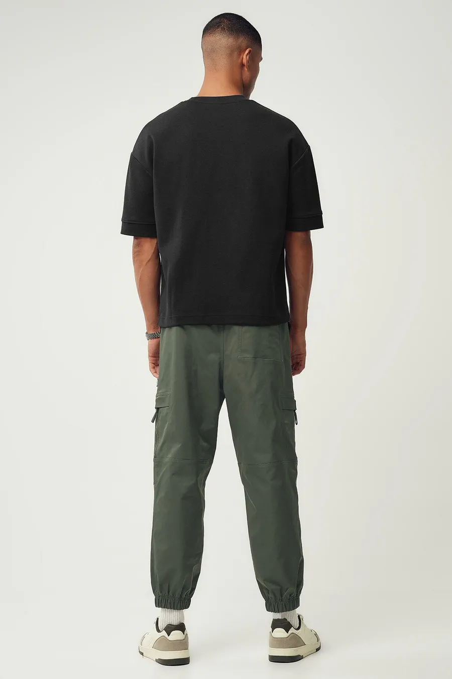 Calças jogger em poliéster · Homem · Verde Oliveira