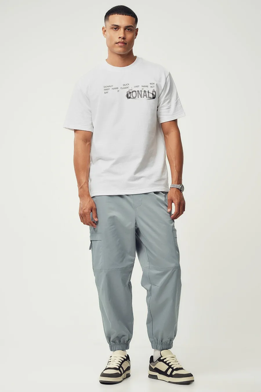 Calças jogger em poliéster · Homem · Cinzento Escuro