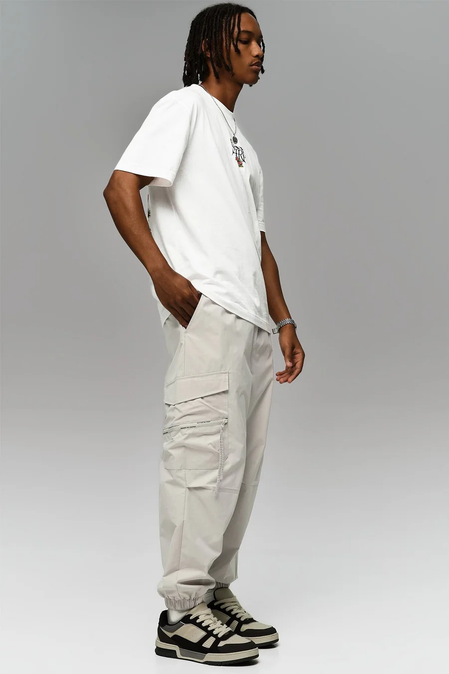 Calças jogger em poliéster · Homem · Creme
