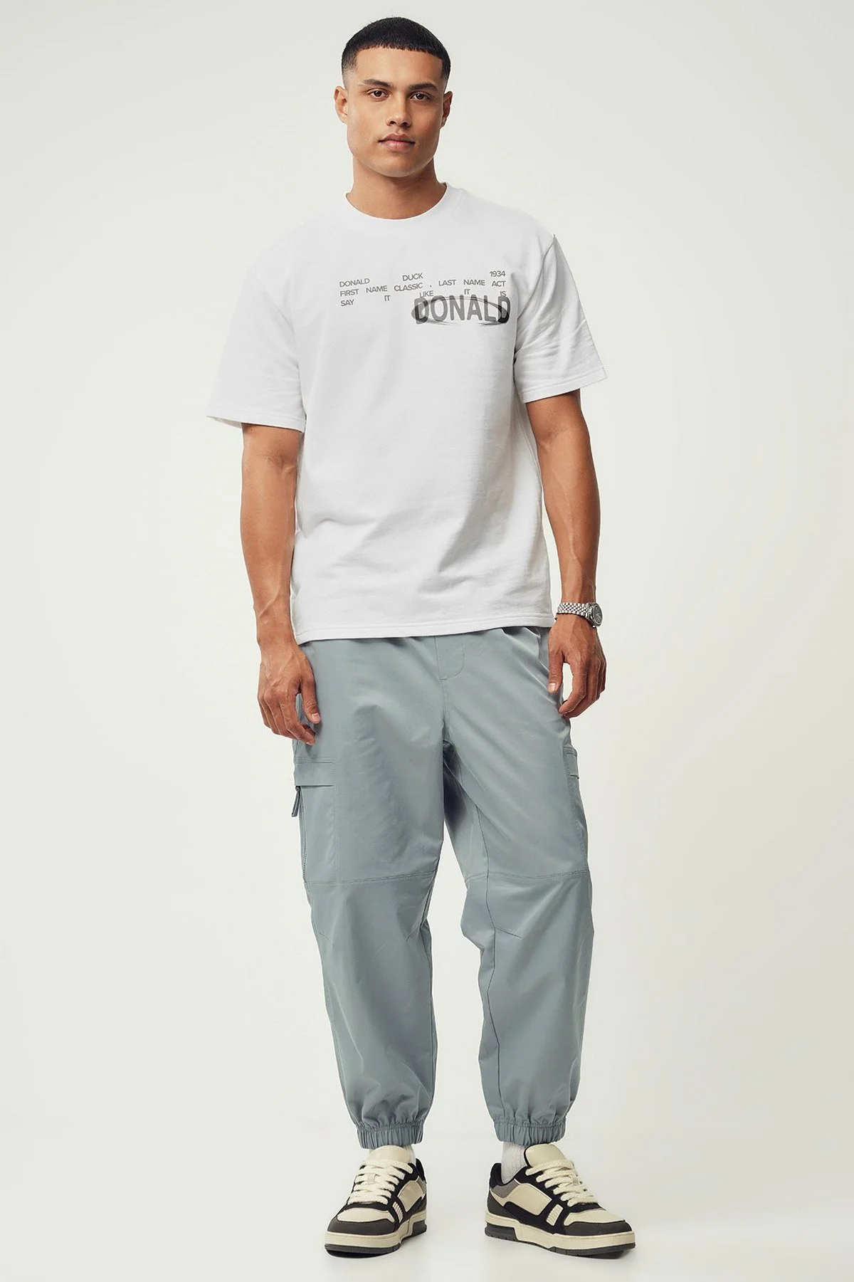 Calças jogger em poliéster · Homem · Cinzento Escuro