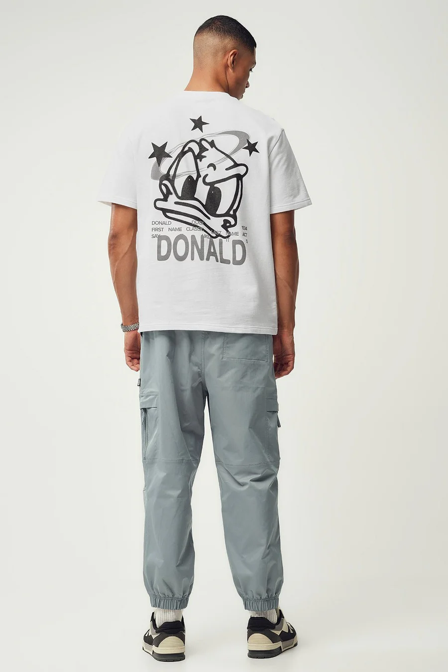 Calças jogger em poliéster · Homem · Cinzento Escuro