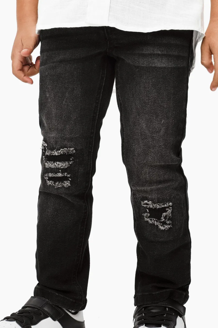 Calças de ganga skinny · Menino